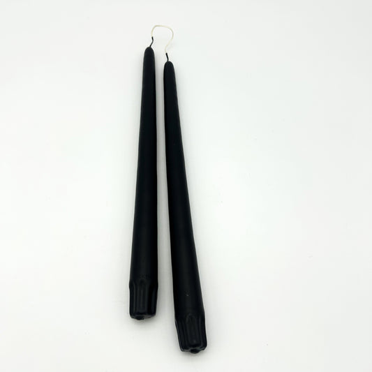 Black earrings on a white background